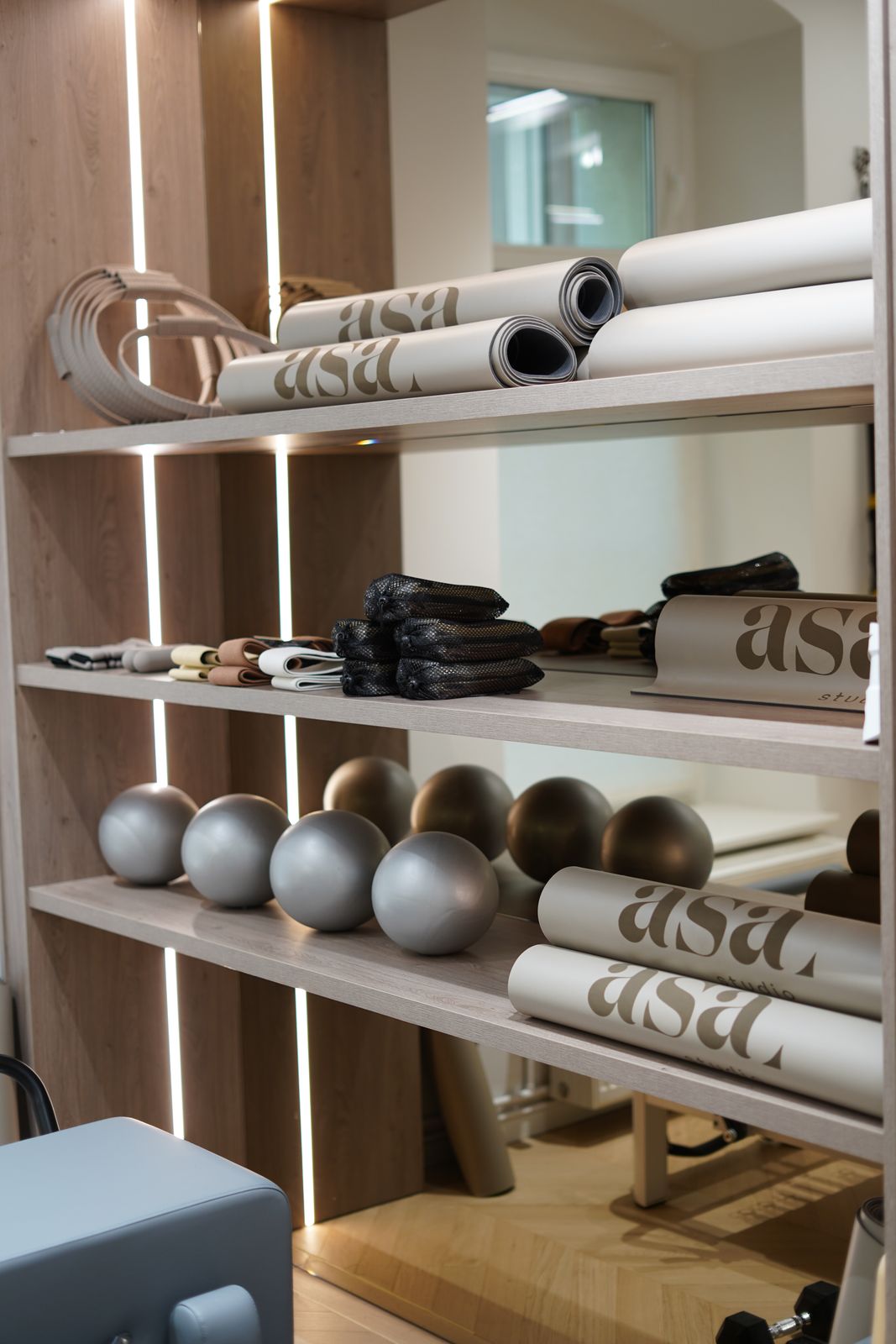 Shelf with ASA mats and Pilates balls